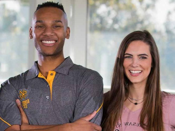 man and woman smiling for picture